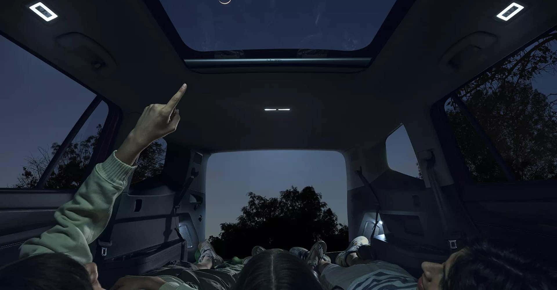 2025 Volkswagon Atlas moonroof two people stargazing