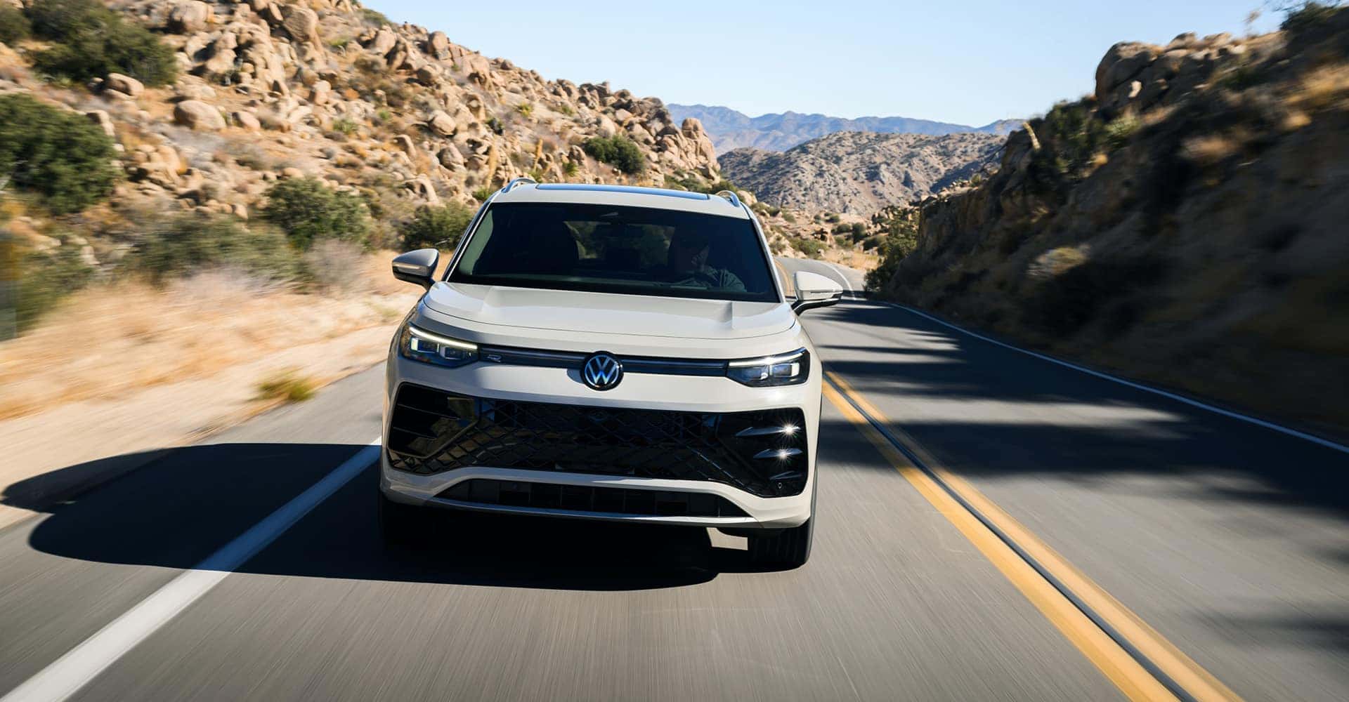 2025 VW Tiguan driving on a road