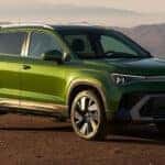 2026-VW-Taos-Moss-Green-on-dirt