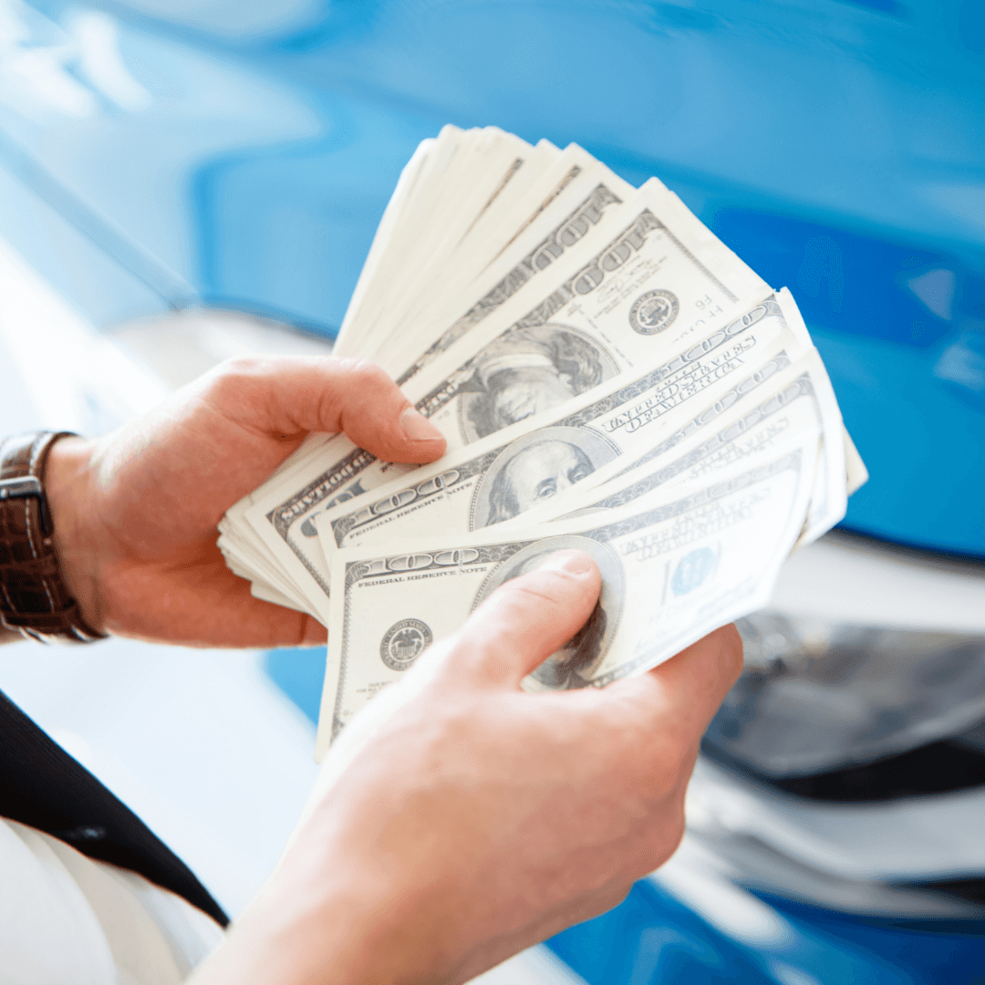 guy counting his money from selling his car to Susquehanna CDJR