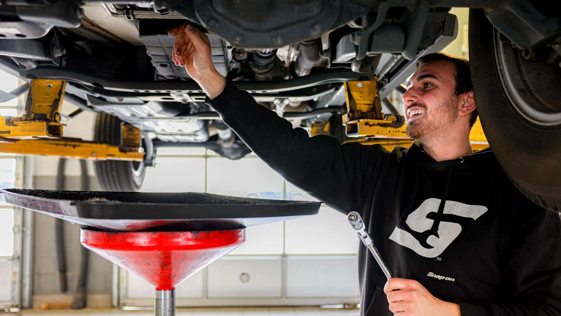 Mechanic performing an oil change