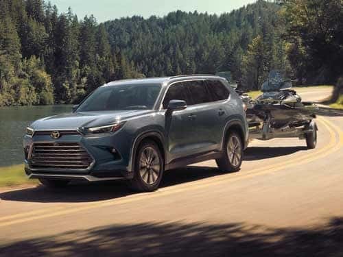 2024 Toyota Highlander towing a boat