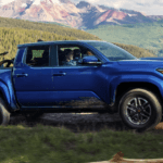 A Toyota Tacoma driving through the mountains