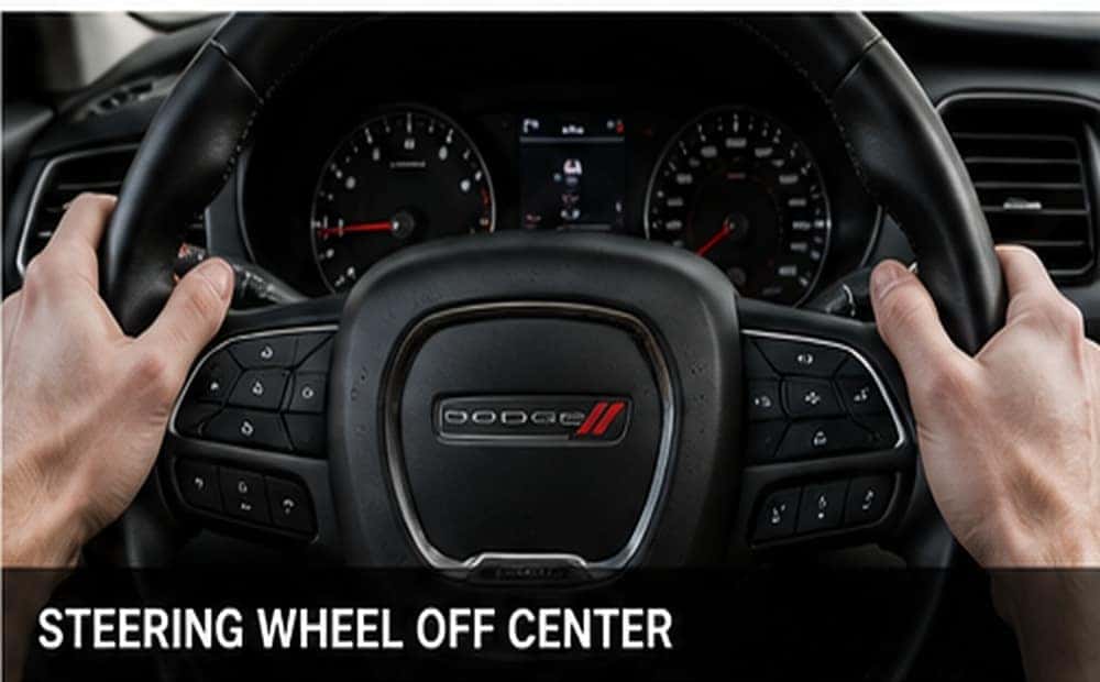 Steering wheel positioned off center while driving straight